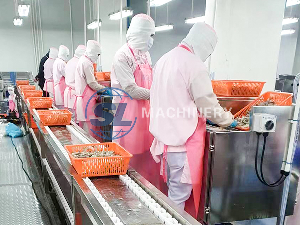 Automatic shrimp peeling and deveining machine for seafood processing